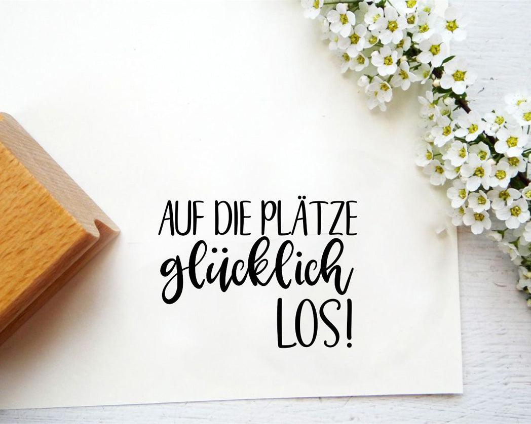 Stempel "Auf die Plätze glücklich los" Schlüssel&Wort